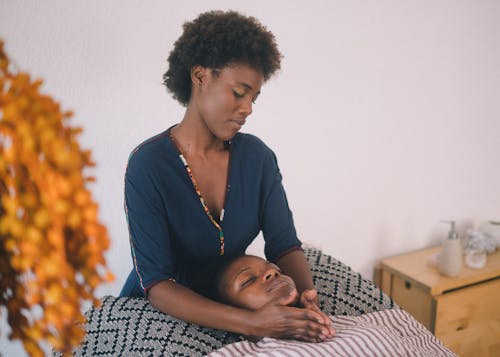 Young woman doing massage in salon