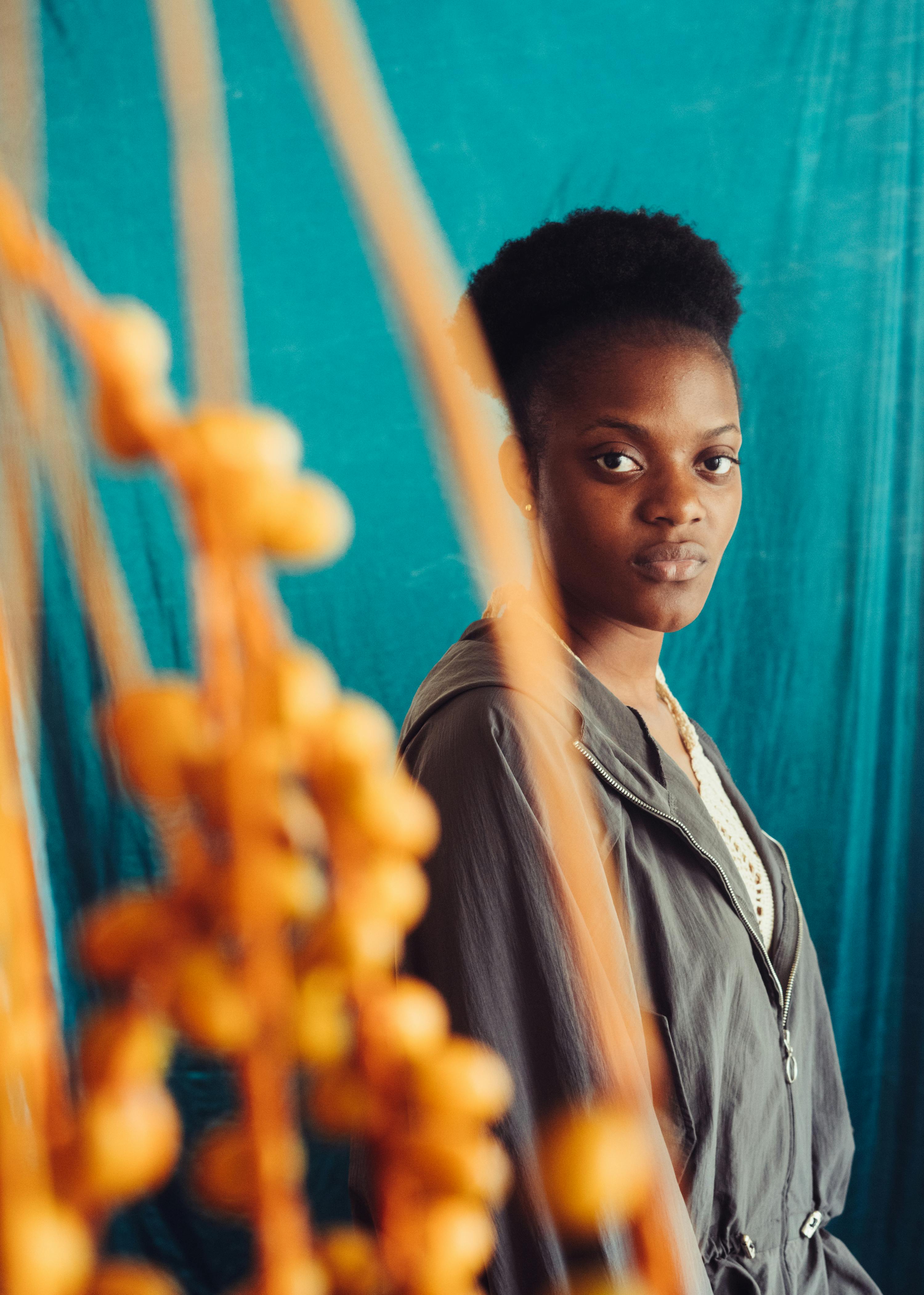 Calm African American Woman In Casual Wear On Blue Background
