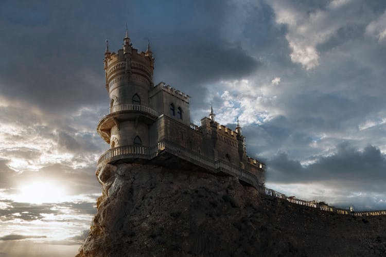 Old Castle On Rocky Cliff