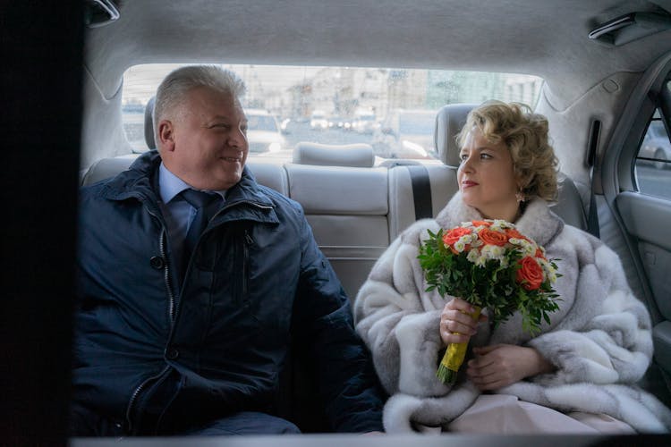 Happy Adult Couple In Car