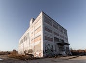 Facade of old abandoned building under sky