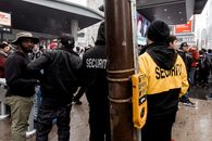 Crowded guarded street in city