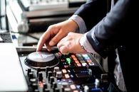Crop dj performing music at concert