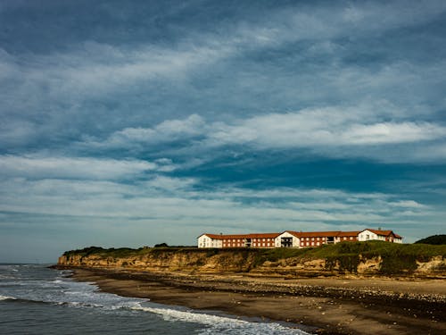 Безкоштовне стокове фото на тему «берег моря, біля океану, дім»