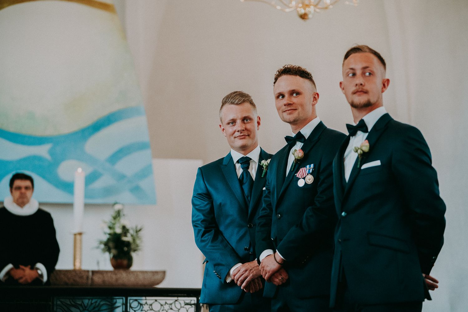 Groomsmen dressed in elegant formal suits at a wedding