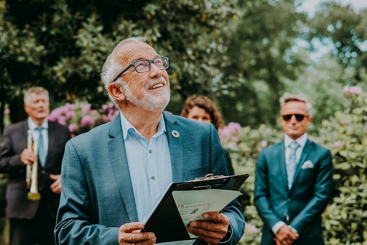 Senior Host Making Speech At Wedding