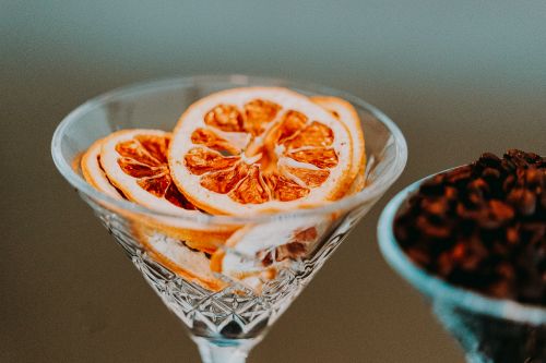 Free Colorful slices of citrus in conical transparent festive glass in daylight on blurred background Stock Photo