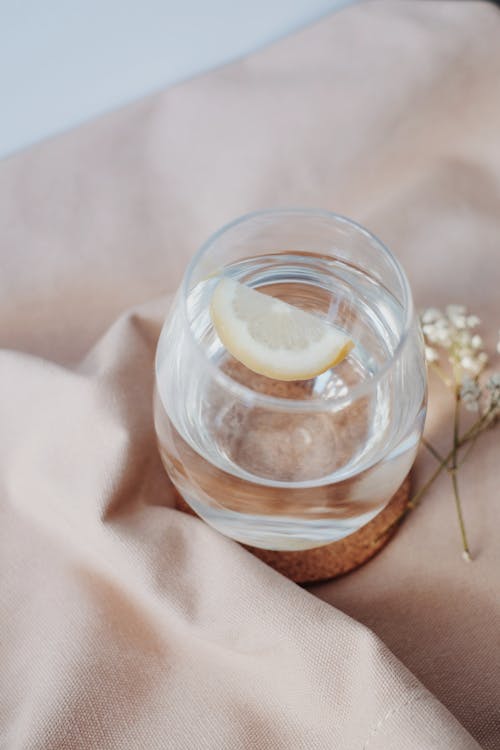 Clear Glass Jar With White Liquid Inside