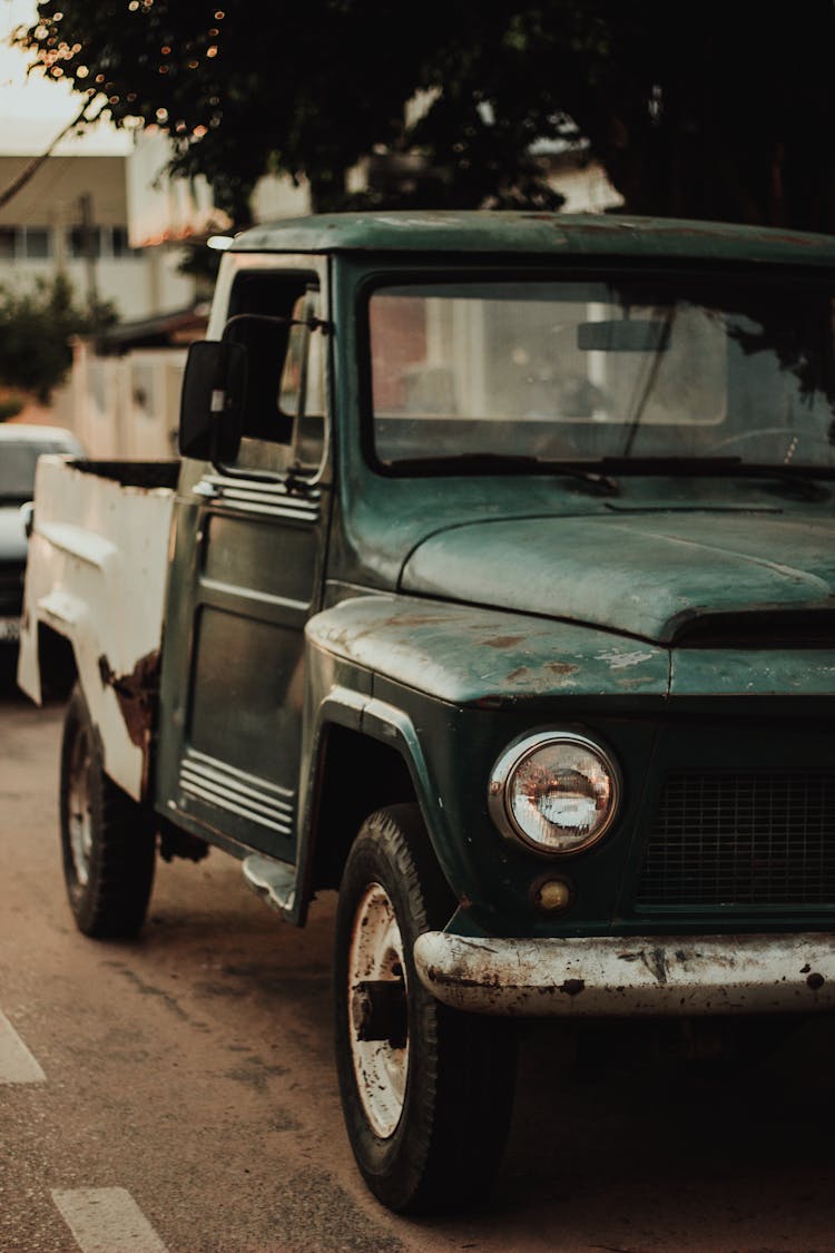 Shabby Truck Parked On Asphalt On Street