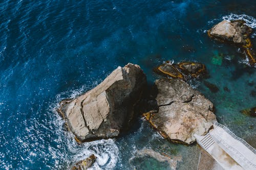 Drone View of Brown Rock Formations on the Beach