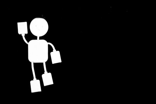 Abstract minimalist image of a white cable figure on a plain black background.