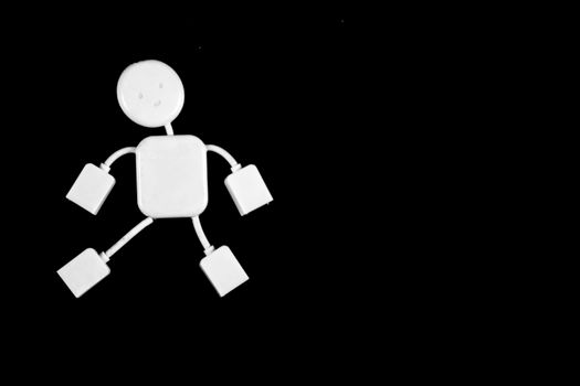 A unique USB hub designed as a robot shape, highlighted on a black background, ideal for tech concepts.