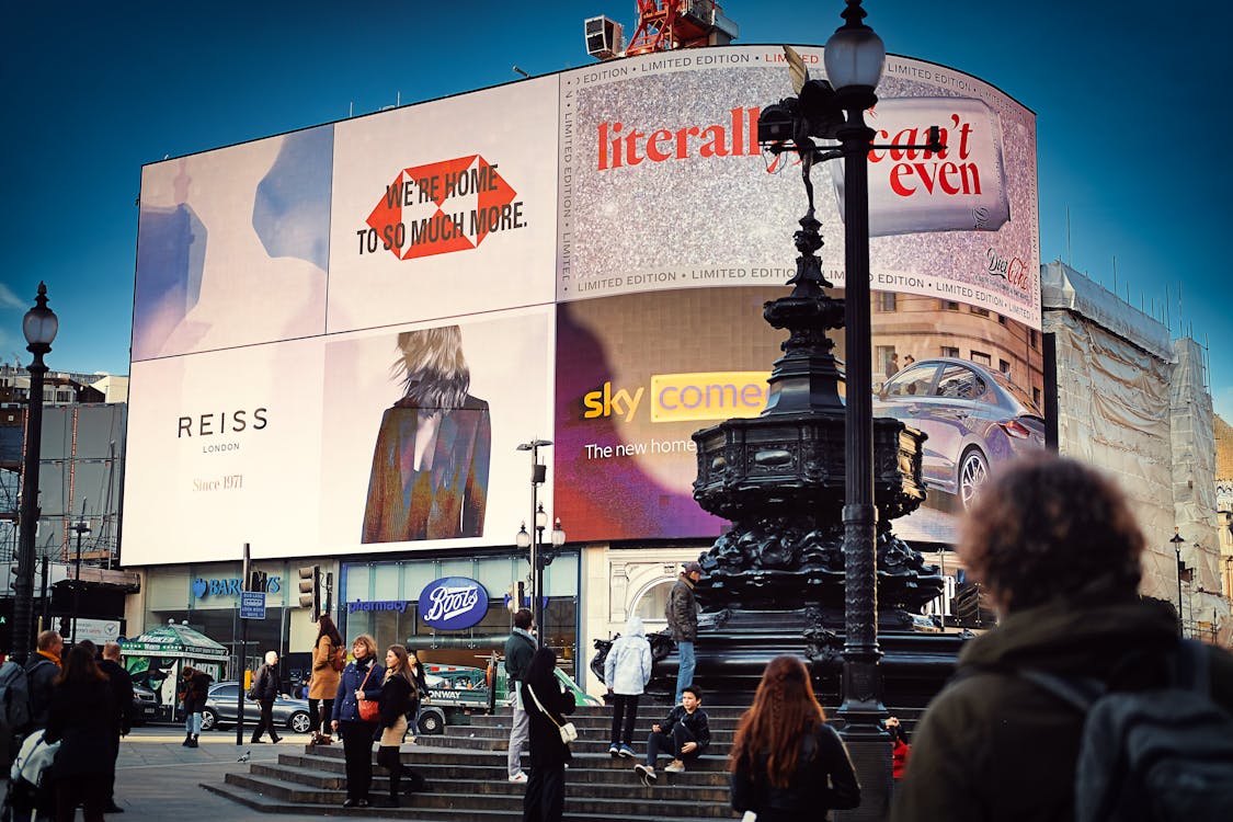 Free People Walking on Piccadilly Circus Stock Photo