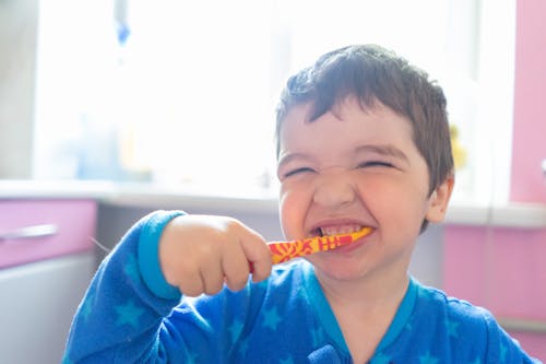 Free Close-up Photo of Boy brushing his Teeth  Stock Photo