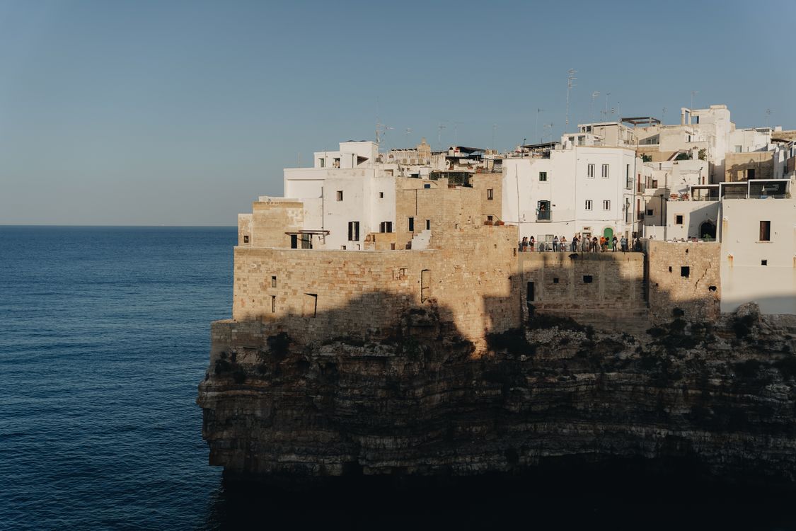 Concrete Buildings on Cliff Edge by the Sea · Free Stock Photo