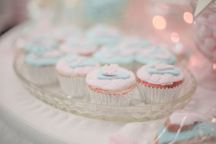 Pastel Colored Cupcakes On A Glass Tray 