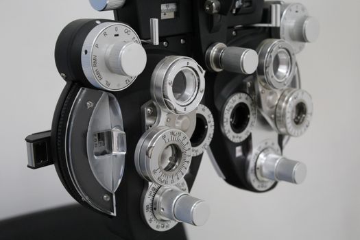 Close-up photo of a phoropter, essential equipment for eye exams.