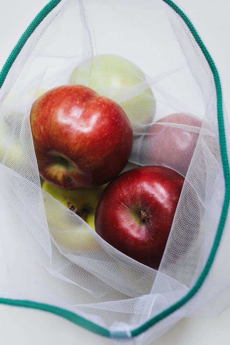 Red Apple On A Mesh Bag 