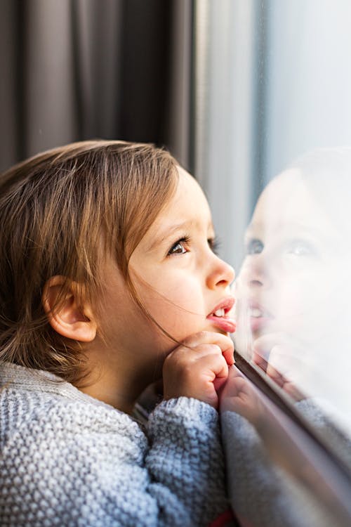 Girl Looking Outside the Window