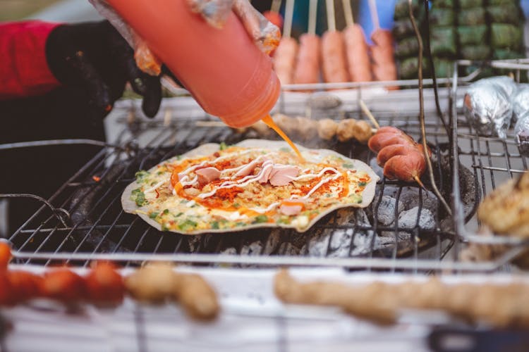 Pizza On Gray Metal Grill