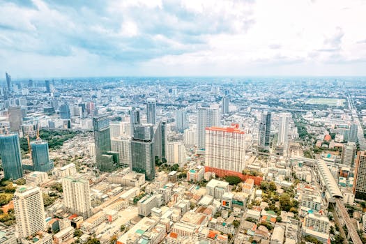 Discover the bustling skyline of Bangkok with its majestic skyscrapers and vibrant city life.
