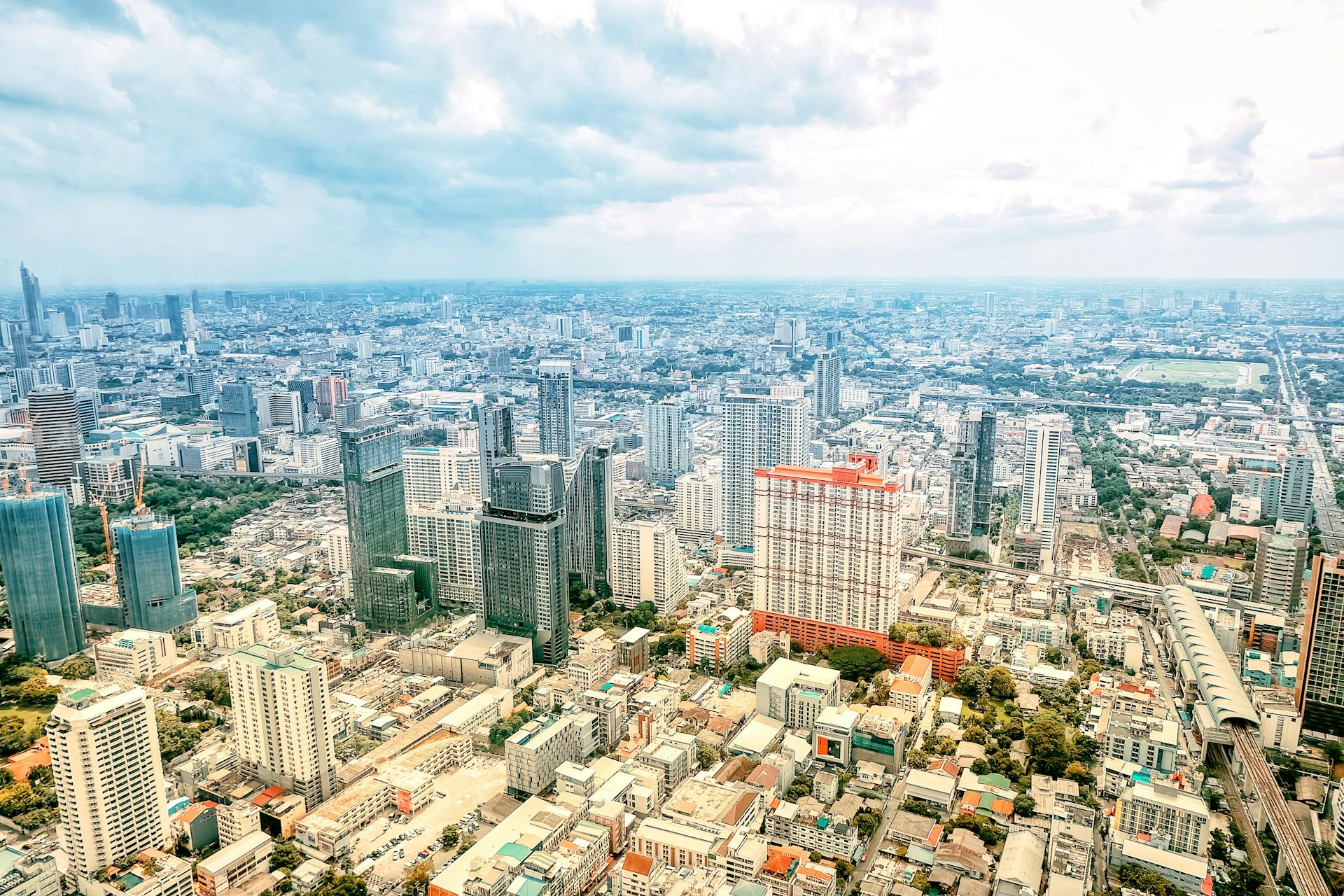 Discover the bustling skyline of Bangkok with its majestic skyscrapers and vibrant city life.