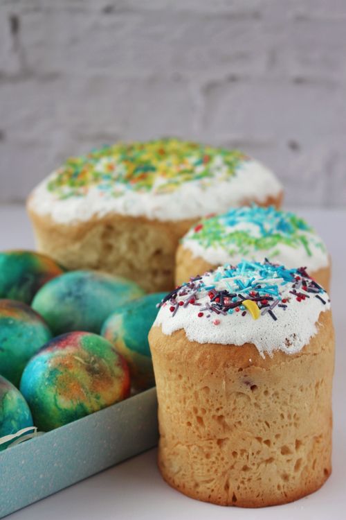Free Easter bread Paska with vibrant dyed eggs, iconic Ukrainian festival treats. Stock Photo