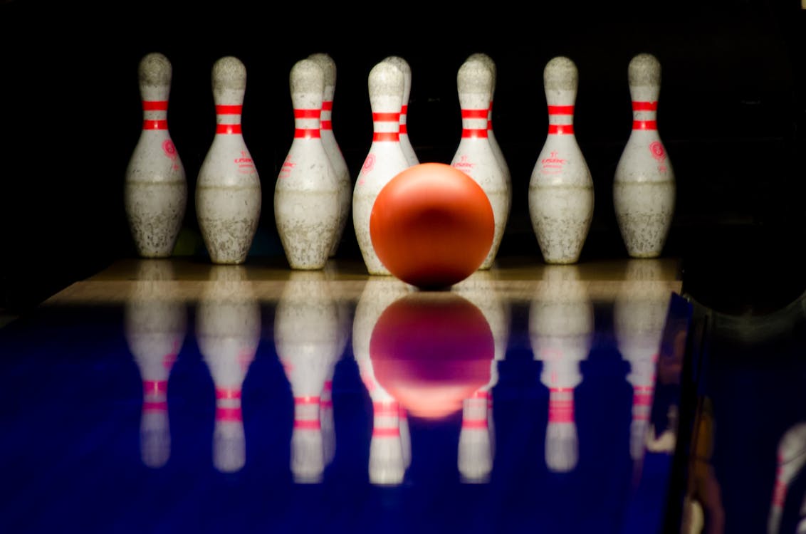 Free White Bowling Pins and Red Bowling Ball Stock Photo