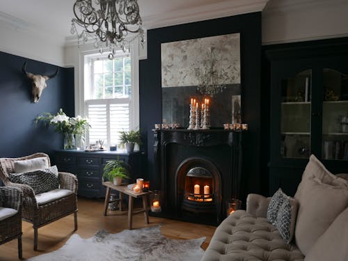 Interior of elegant living room with fireplace and vintage furniture