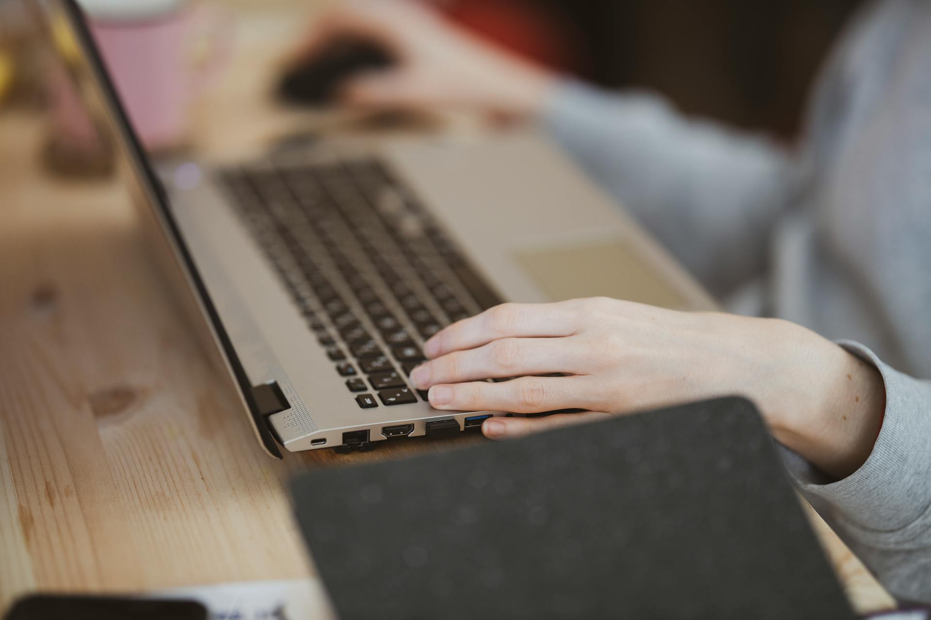 Person's Hand on a Laptop