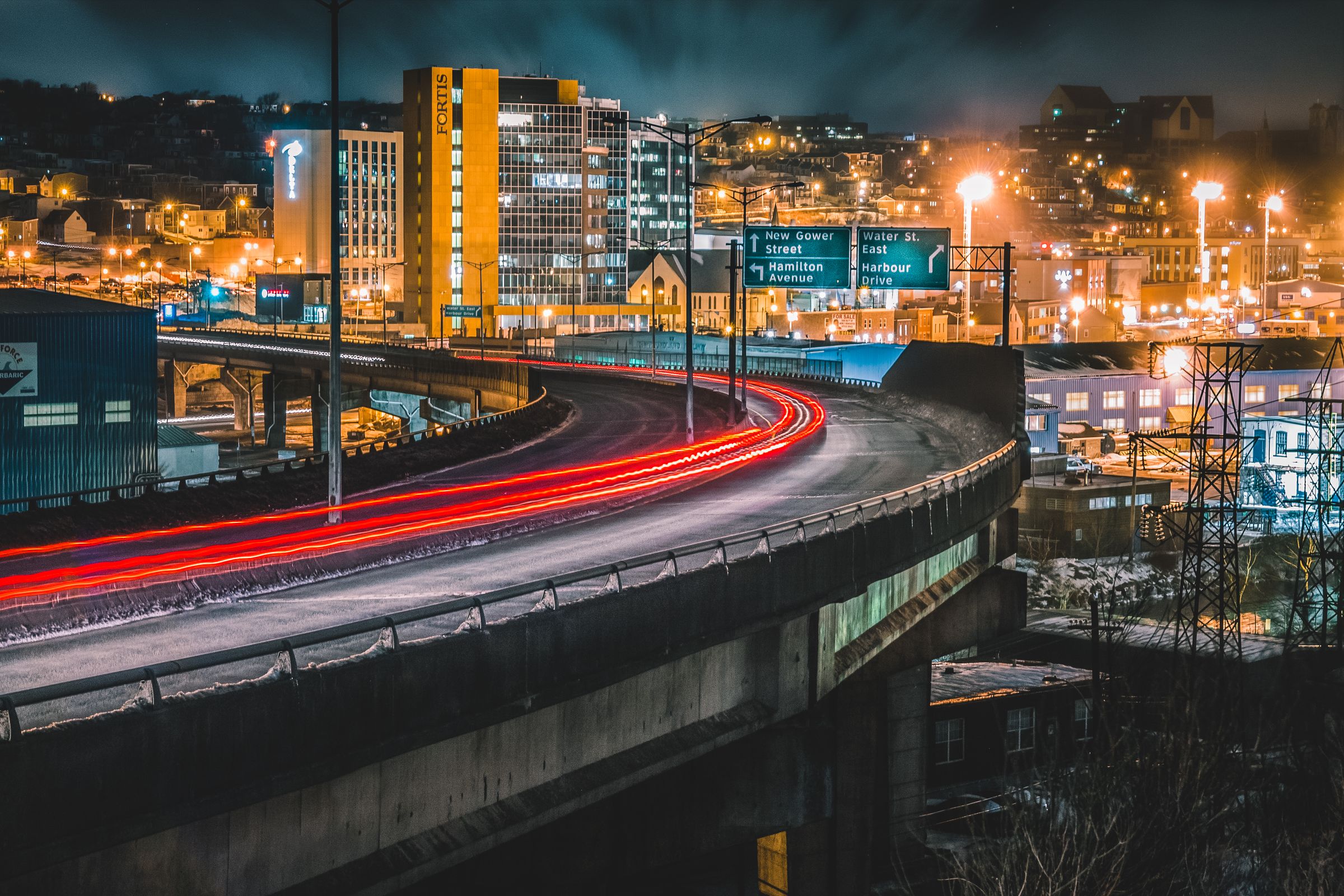 City bridge at night with light trails
