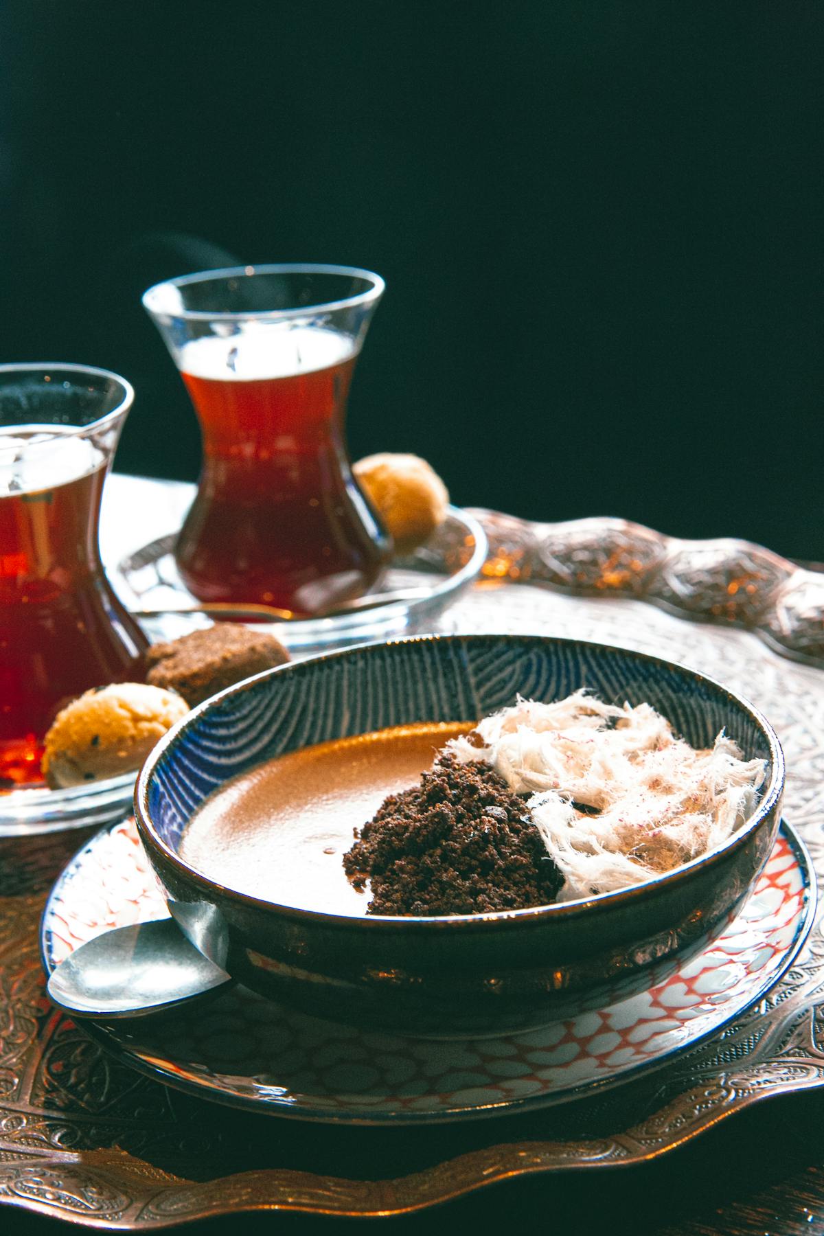 A bowl of creamy chicken and lentil soup garnished with herbs and yogurt