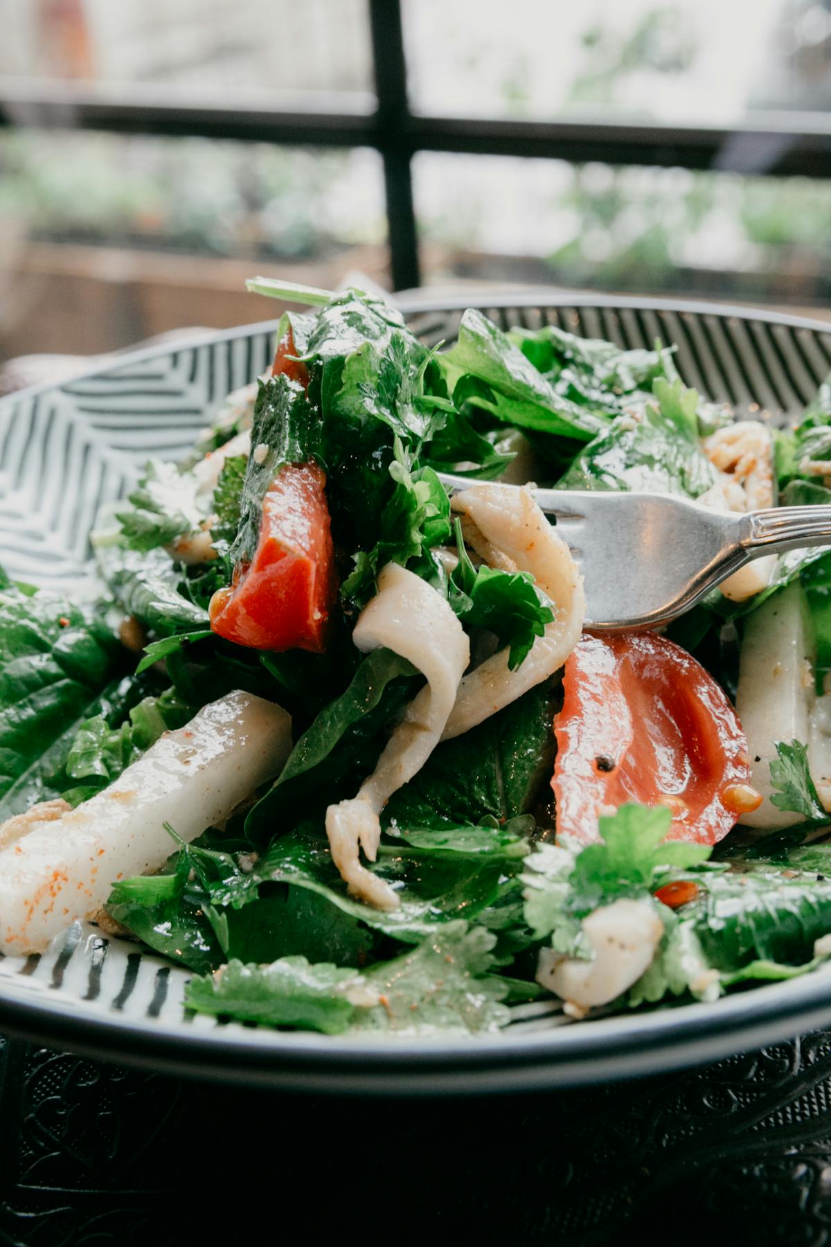 Assorted wild mushrooms including lion’s mane and oyster mushrooms on a wooden board