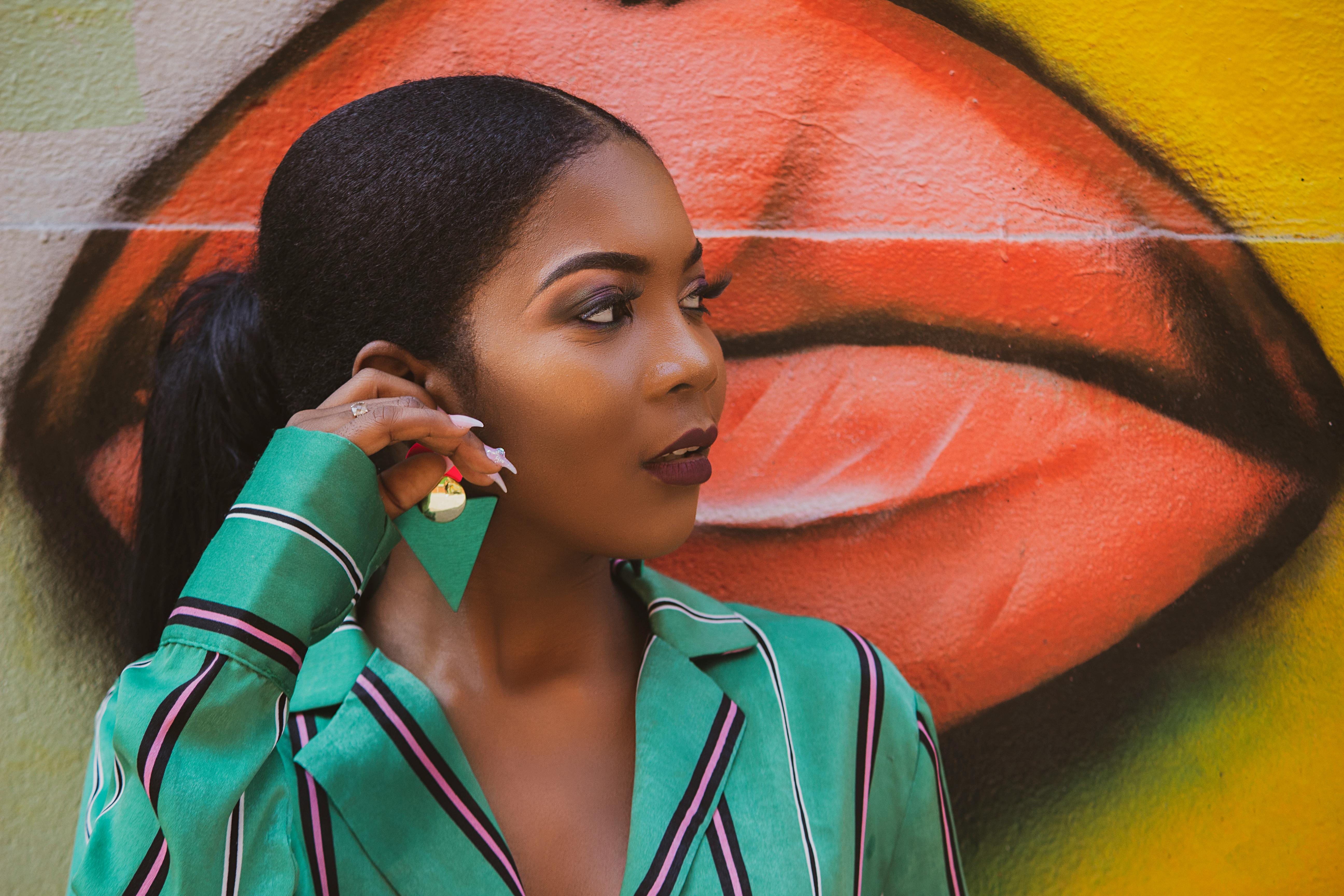 woman in green and white stripe button up shirt