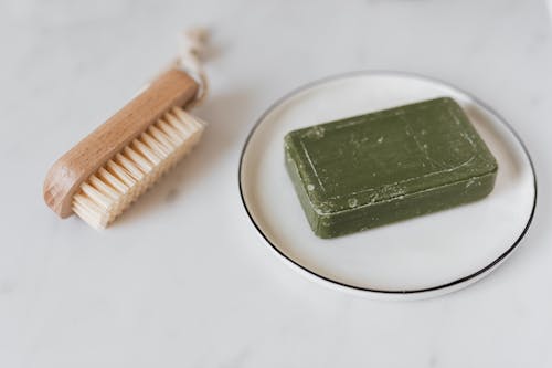 Green Soap in a Ceramic Plate 