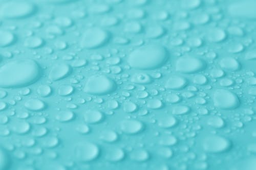 Water Droplets on Blue Surface