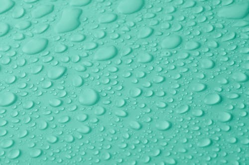 Water Droplets on Blue Surface