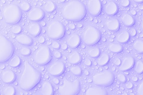 Free Waterdrops On Purple Background Stock Photo