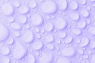 Waterdrops On Purple Background
