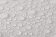 Transparent water drops on white background