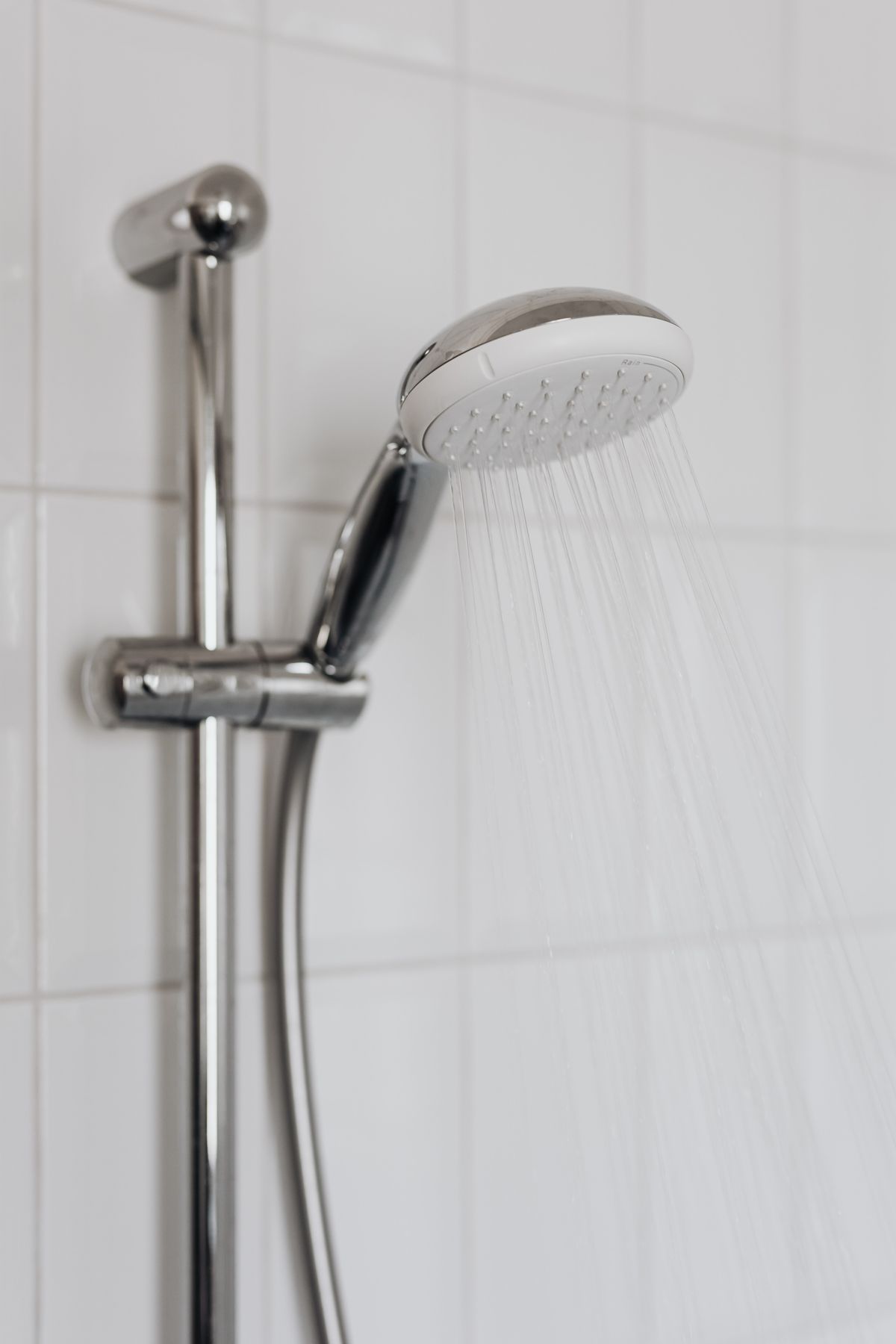 close up of a shower head spraying clean filtered water