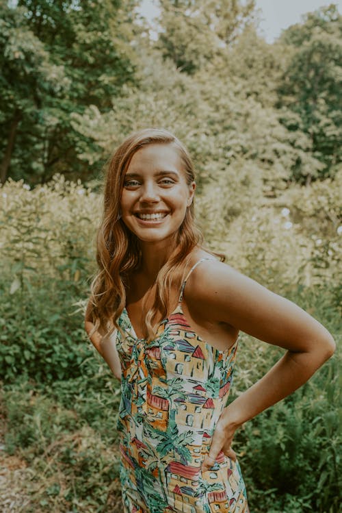 Cheerful young woman enjoying nature in countryside