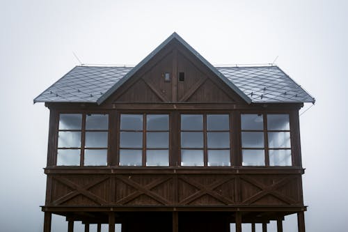 Brown Wooden House under Gloomy Skies