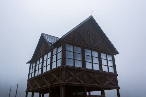Brown Wooden House under Gloomy Skies