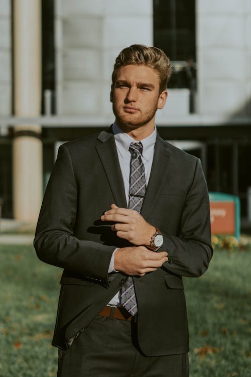 Free Successful businessman in elegant suit standing on street Stock Photo