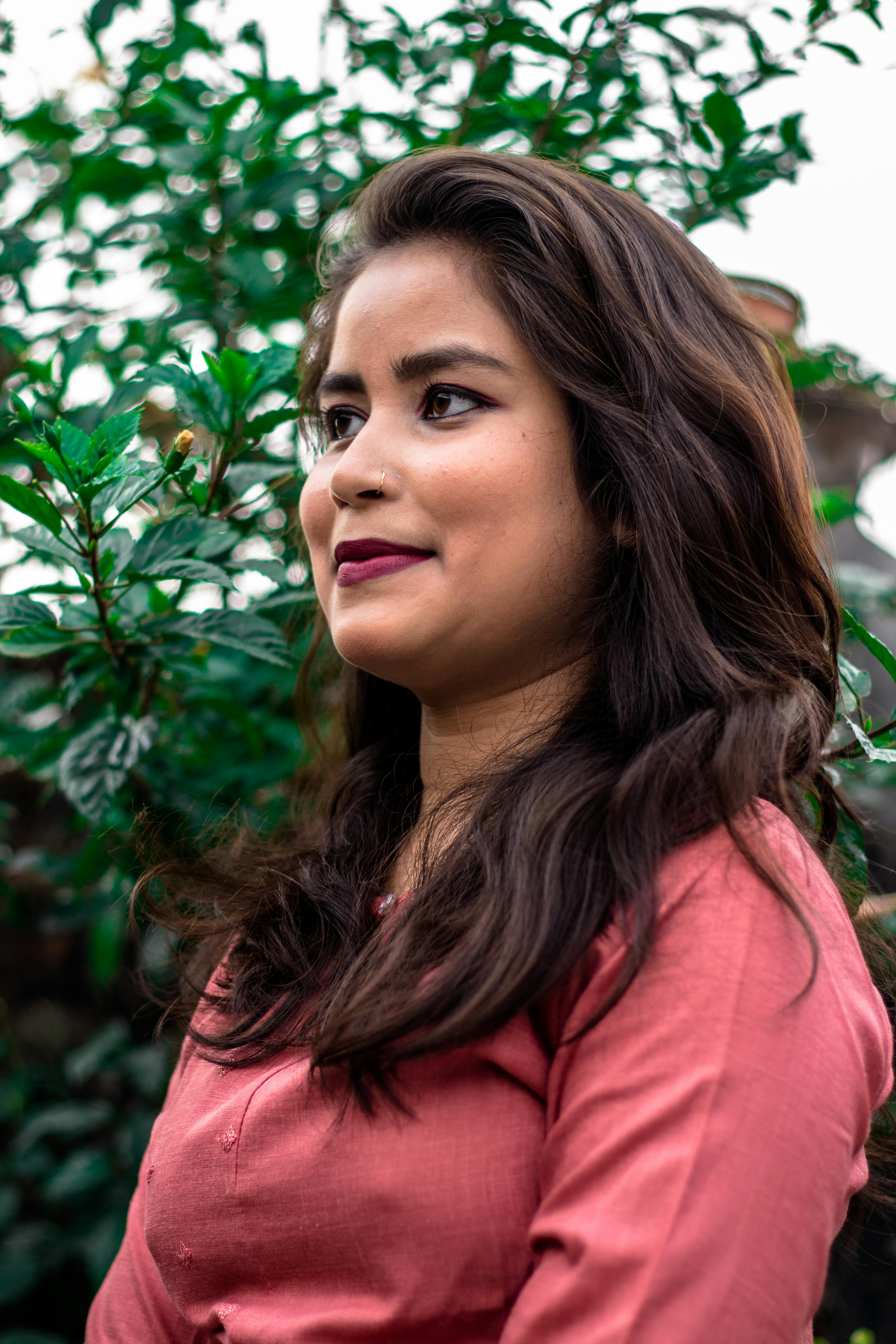 Portrait of a stylish young woman enjoying a dreamy day outdoors.