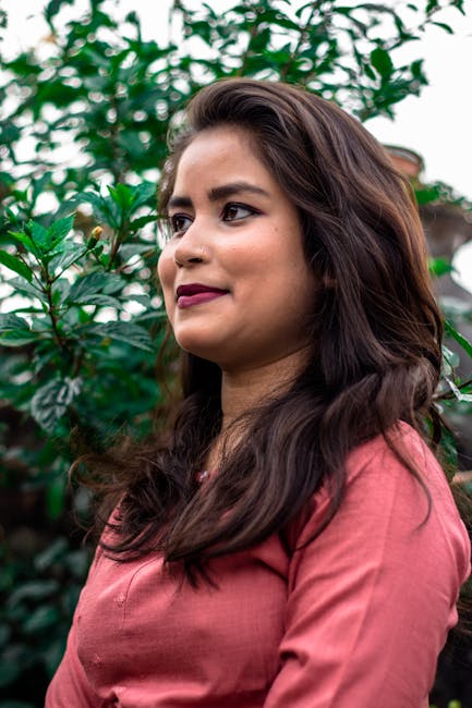 Portrait of a stylish young woman enjoying a dreamy day outdoors.