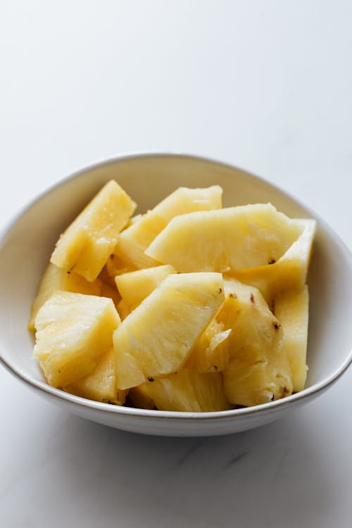 Free Bowl of sweet fresh sliced pineapple Stock Photo