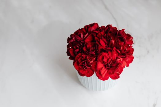 Bunch of carnations in decorative flowerpot