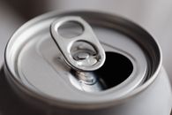 Open grey metal soda can